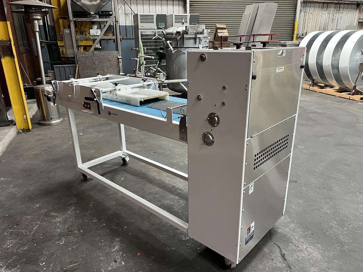Used Bloemhof model Express 1260 molder and dough sheeter for breads