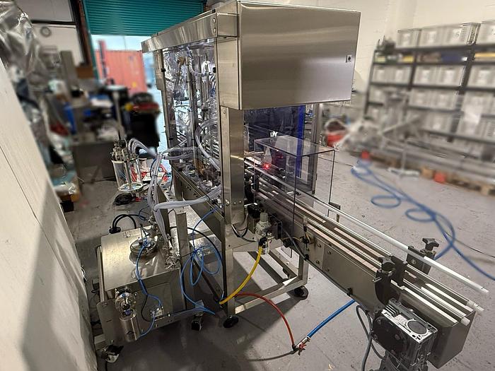 Used Universal Posivac 4 Head Liquid Filler