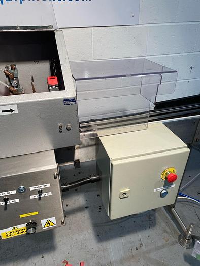 Used Sold Push on Capper with Conveyor at GlobePack Equipment