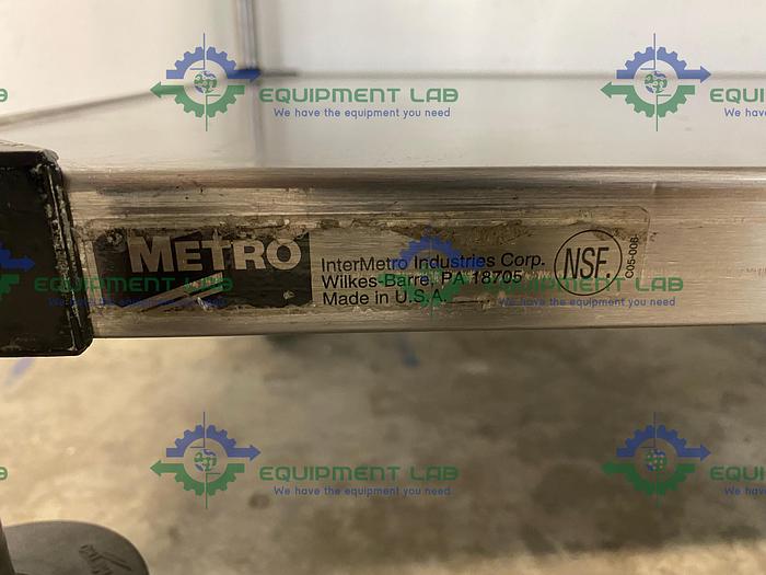 Used Metro  60" W x 24" D x 38" H Two Tier Stainless Steel Rolling Utility Cart