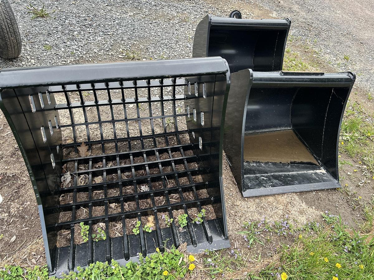 A Firewood Splitter or A Backhoe bucket