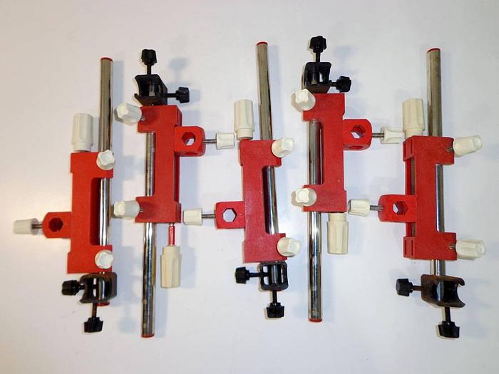 Used Injection Molded Nylon Laboratory Lead Screw Positioners on Steel Rods and Steel Square Type Bosshead Clamps, 5 pcs.