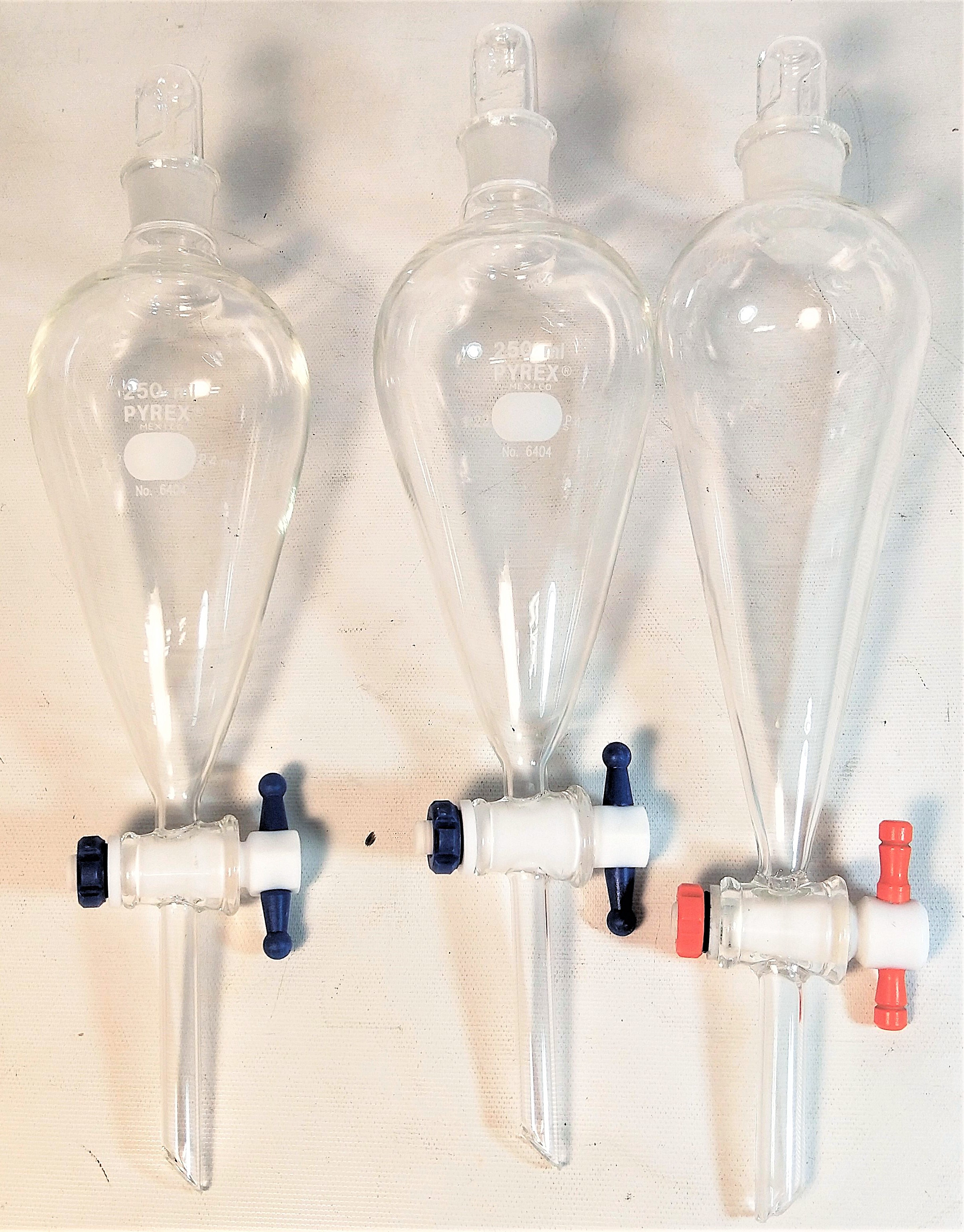 Used Corning (or Equivalent) Squibb Separatory Funnel with PE Stopper - 250mL