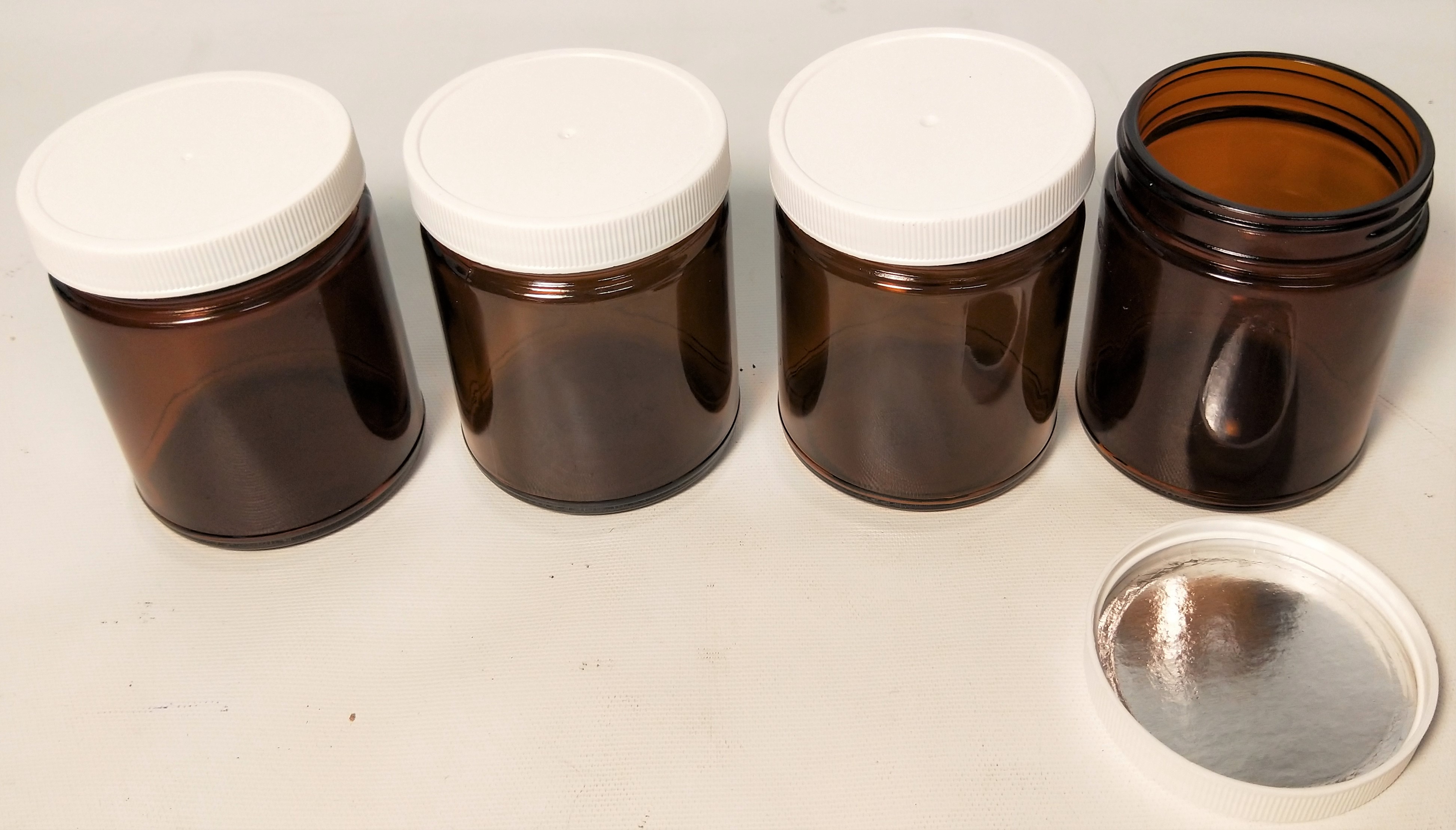 New Open Box Lot of Amber Glassware and Plasticware - Bottles and Jars