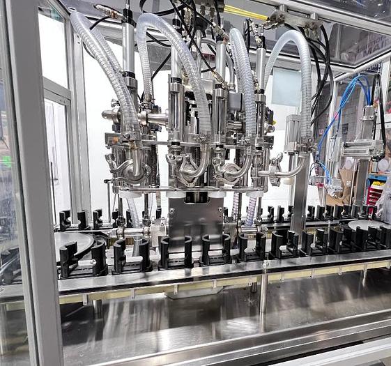 Used COMAS RTS4 - Remplisseuse 4 buses automatique avec tête de vissage & station de pressage