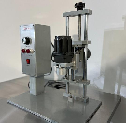 D'occasion DDX - 450 - Bouchonneuse de table semi-automatique