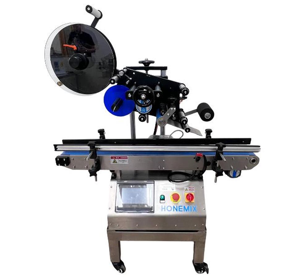 D'occasion HONEMIX HONE TOP - Étiqueteuse à pose dessus automatique