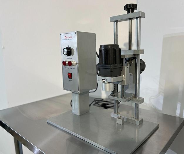 D'occasion DDX - 450 - Bouchonneuse de table semi-automatique