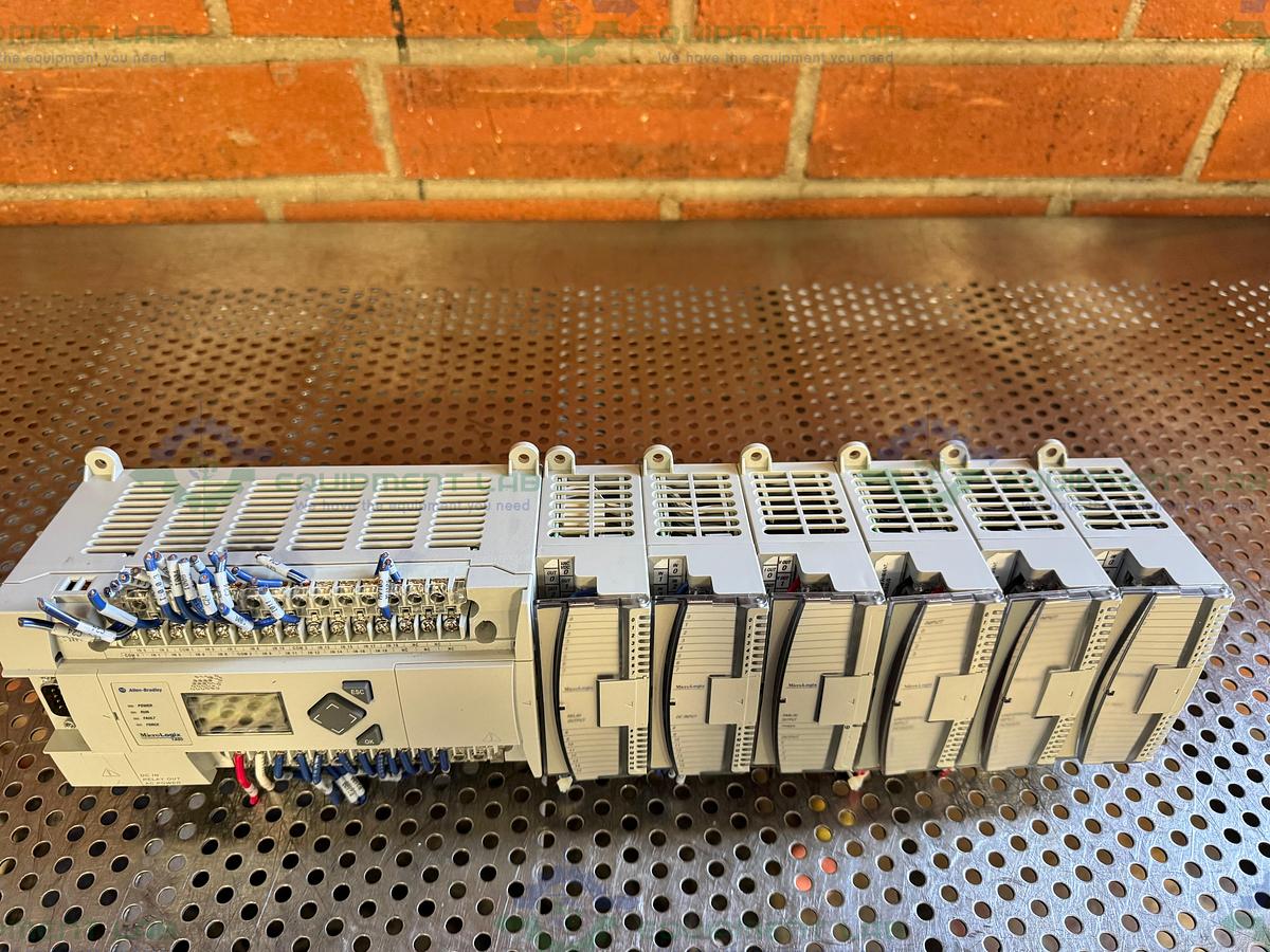 Used Allen Bradley Micrologix 1400 Controller w/ 2- 1762-IQ16, 1762-OF4,1762-OW16
