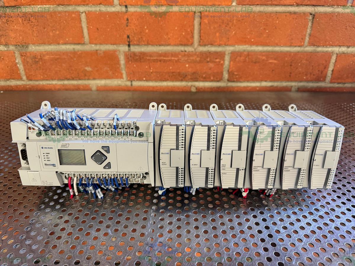 Used Allen Bradley Micrologix 1400 Controller w/ 2- 1762-IQ16, 1762-OF4,1762-OW16
