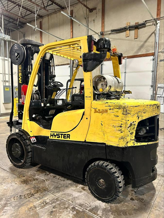 Opposite front angle of 2020 Hyster S155FT 15,500 lb cushion forklift with 102/185” mast and forks lowered