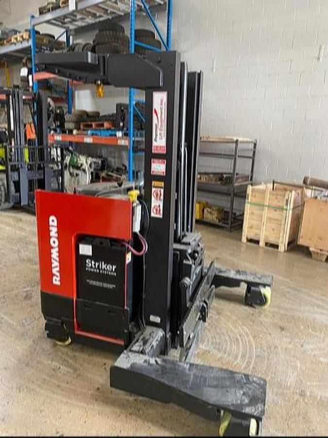CSA‑certified Raymond electric forklift side view showing 4‑way reach mast and 4,500 lb capacity