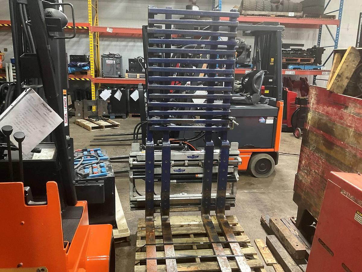 Front angled view showing dual-pallet clamp arms and fork spread