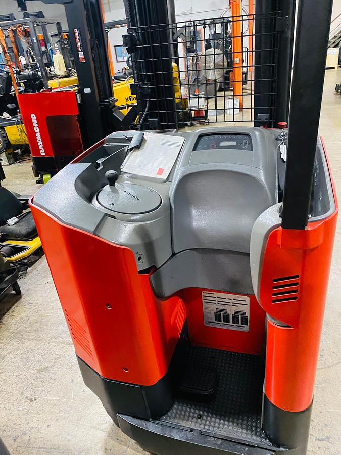 Operator compartment view showing stand-up controls and side-stance layout