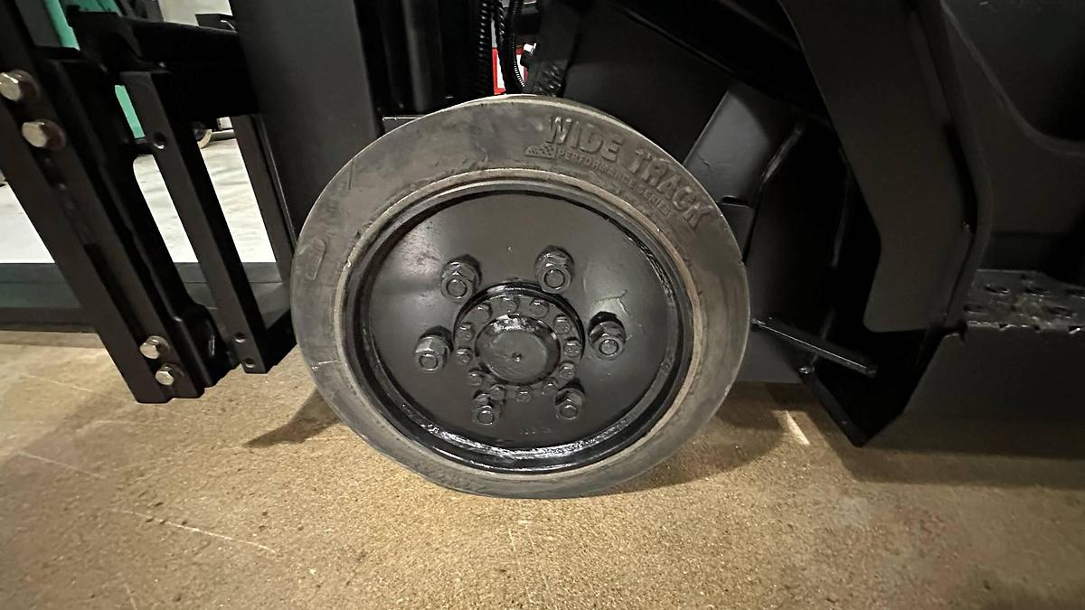 Left cushion drive tire showing wheel hub and CSA spec