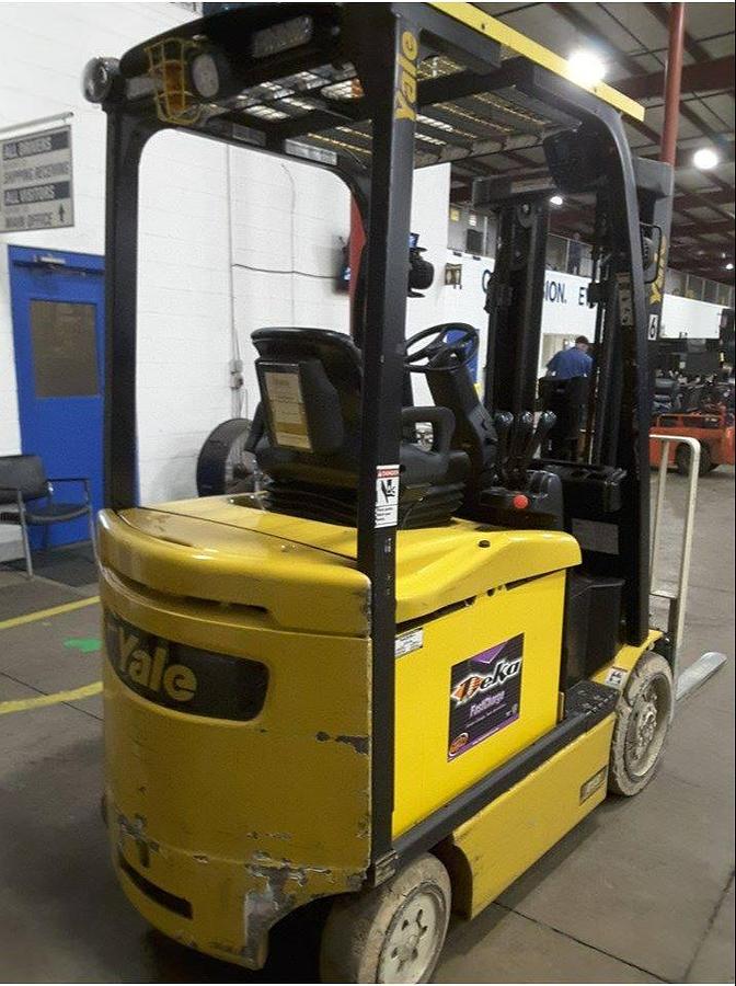 Back view of refurbished 2014 Yale ERC050VGN electric forklift showing counterweight, battery compartment, and CSA inspection tag during Brampton deployment