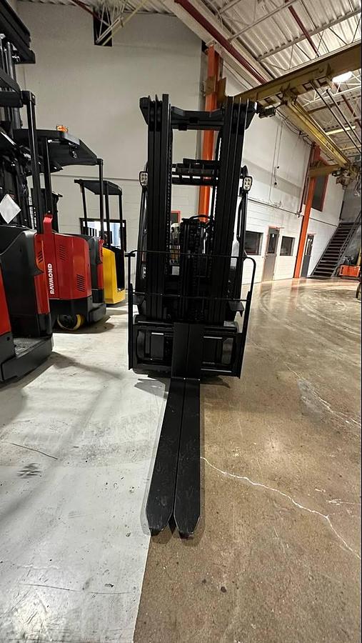 Front view of mast, forks, side shifter attachment  and load backrest