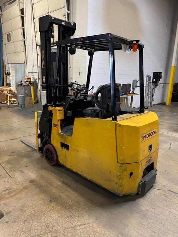 Drexel SLT30 – rear angle opposite side – chassis profile, solid tires, operator cab – CSA electric swing mast forklift – Brampton ON