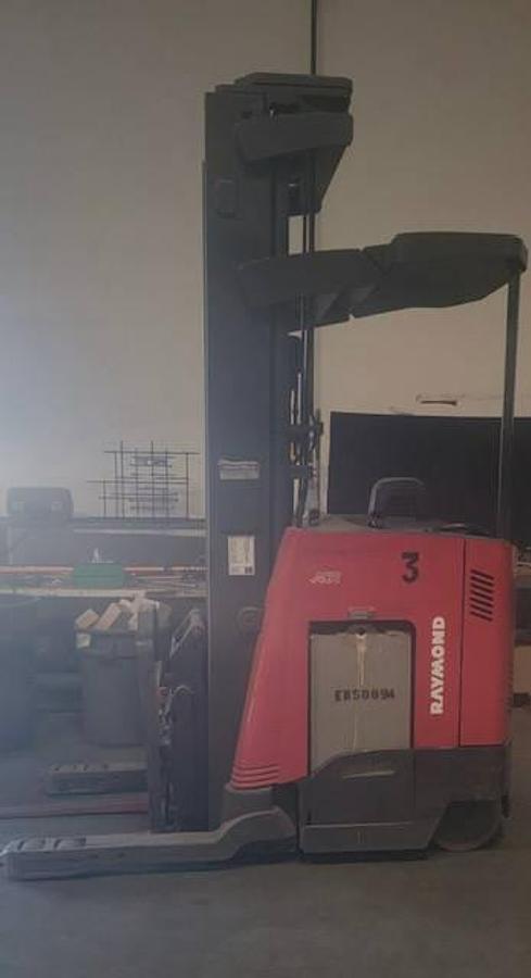 Side profile of Raymond 740DR32TT electric deep-reach forklift showing extended mast rails, reach mechanism, and chassis layout during Brampton deployment