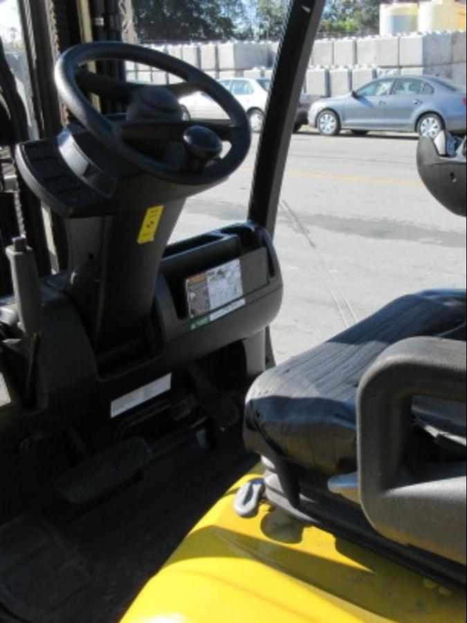 Close-up of Yale GLC070VX operator compartment showing mini levers, steering wheel, and instrument cluster during Brampton deployment