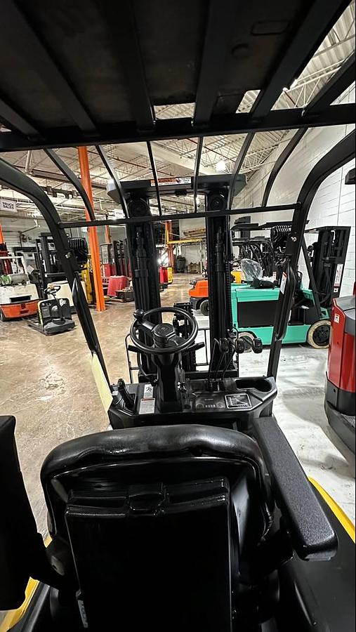 Operator seat view showing dashboard, controls, and CSA labelin