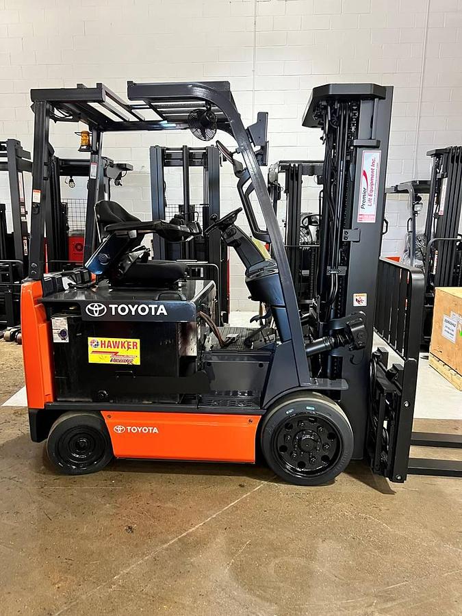 Profile view of 2020 Toyota 8FBCU32 electric forklift showing 4-wheel chassis, battery compartment, and side shift carriage