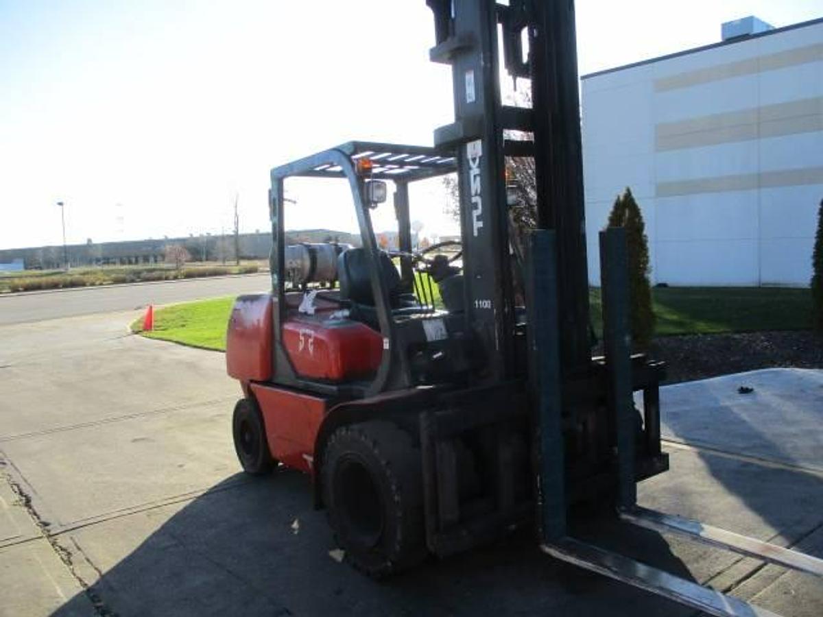 Front angle view of 2008 Tusk 1100PGA2-8 propane forklift showing 2-stage mast, extended 48” forks, side shift carriage, and CSA-certified chassis – unit staged in Brampton ON