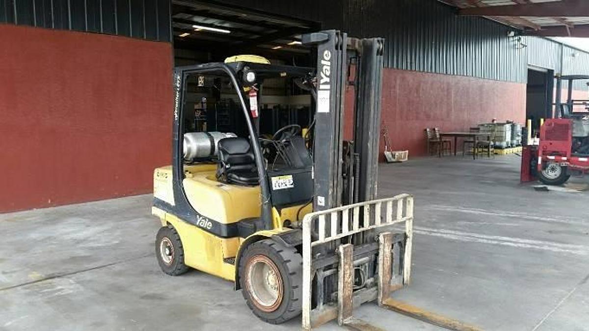 Front side angle view of refurbished 2007 Yale GLP060VX LPG pneumatic forklift showing 91/188 triple mast, side shift carriage, 48" forks, and solid pneumatic tires during Brampton deployment
