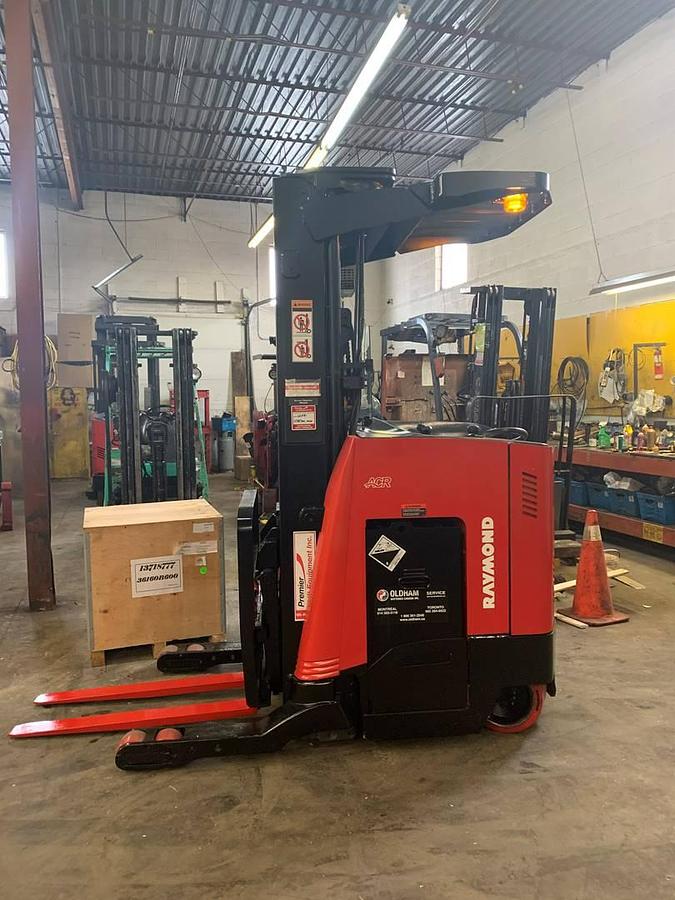 Refurbished 2016 Raymond 730-R45TT electric reach truck with CSA certification and new paint deployed in Mississauga for narrow aisle warehouse operations
