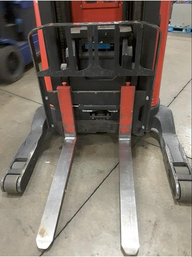 Front view of refurbished 2013 Raymond 750R45TT electric reach truck showing 42" forks, base leg spacing, reach carriage, and side shift mechanism during Vaughan deployment