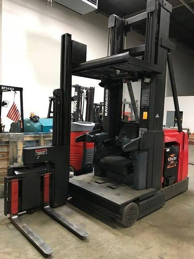 Front view of refurbished 2001 Raymond SA-CSR30TWG electric man-up turret truck showing mast articulation, 42" forks, and swing reach carriage during Ontario deployment
