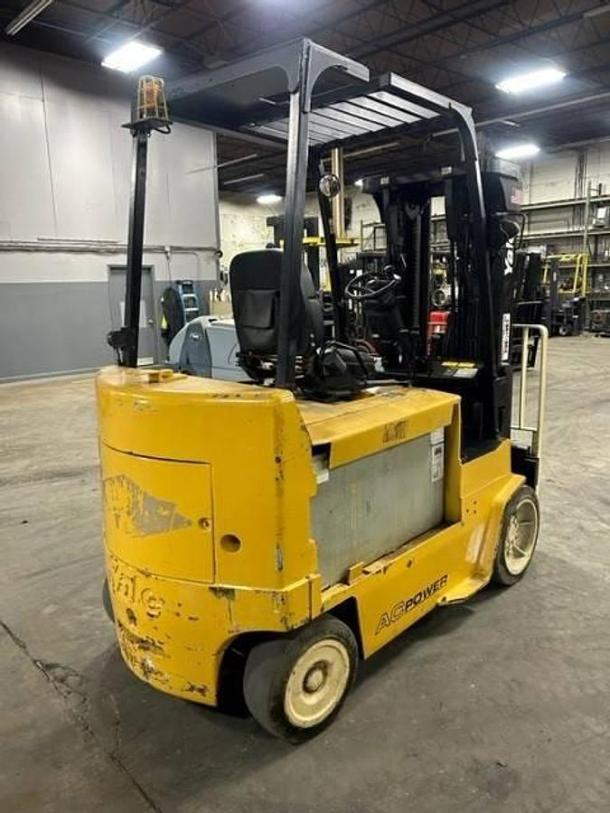Back view of refurbished 2011 Yale ERC080HHN electric forklift showing counterweight, battery compartment, and CSA inspection tag during Brampton deployment
