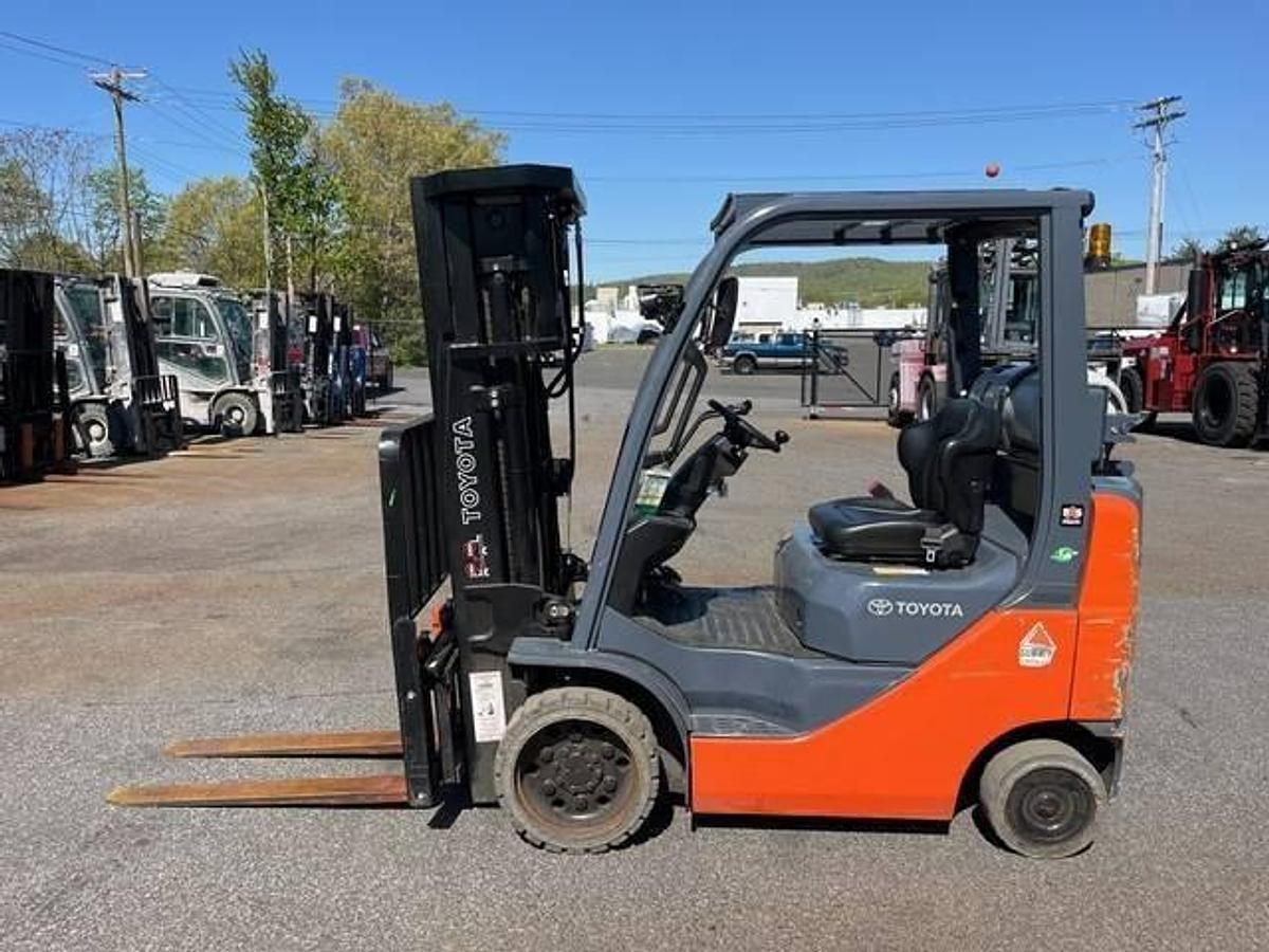 Side view of refurbished Toyota 8FGCU20 LP gas forklift showing operator cab, chassis, and mast during Brampton deployment