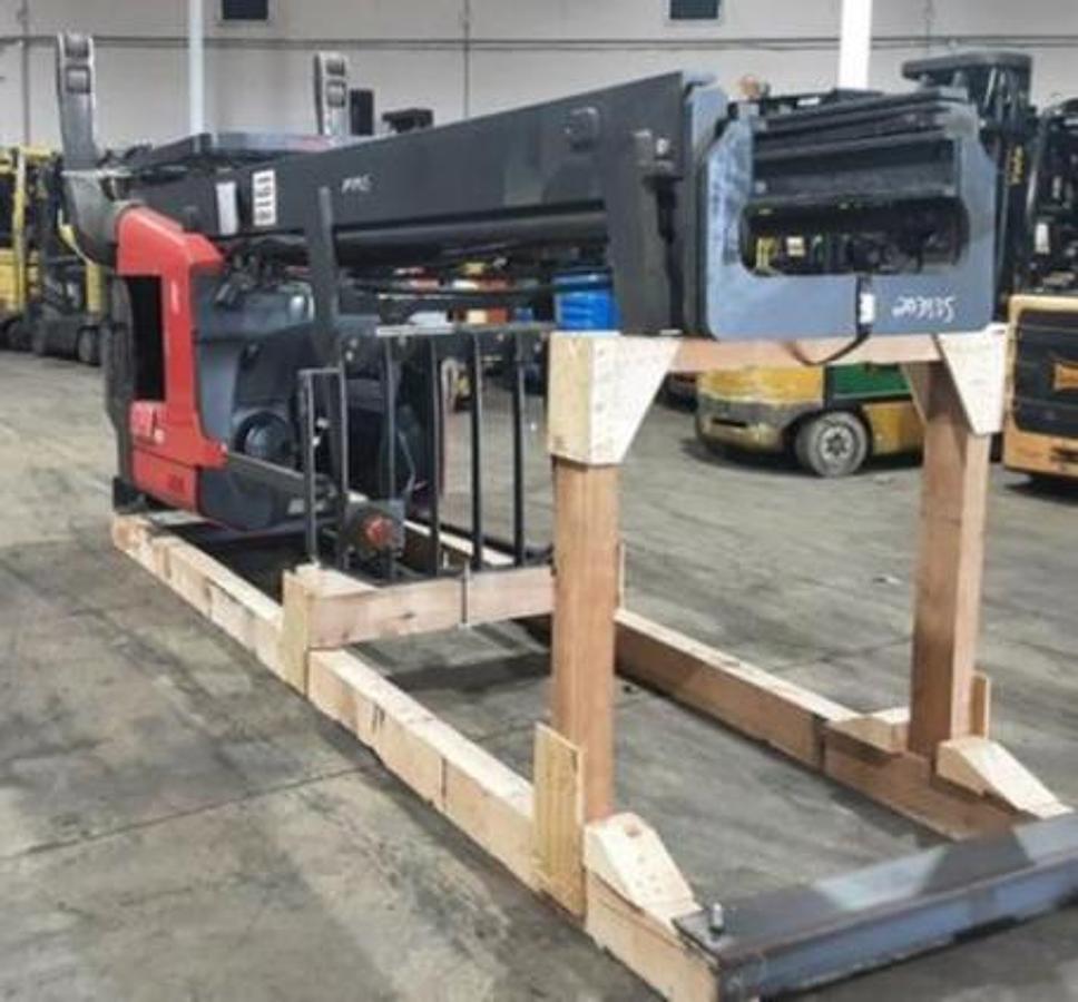 Opposite Laid down and Cradled Front angled view showing mast rails and compact chassis profile