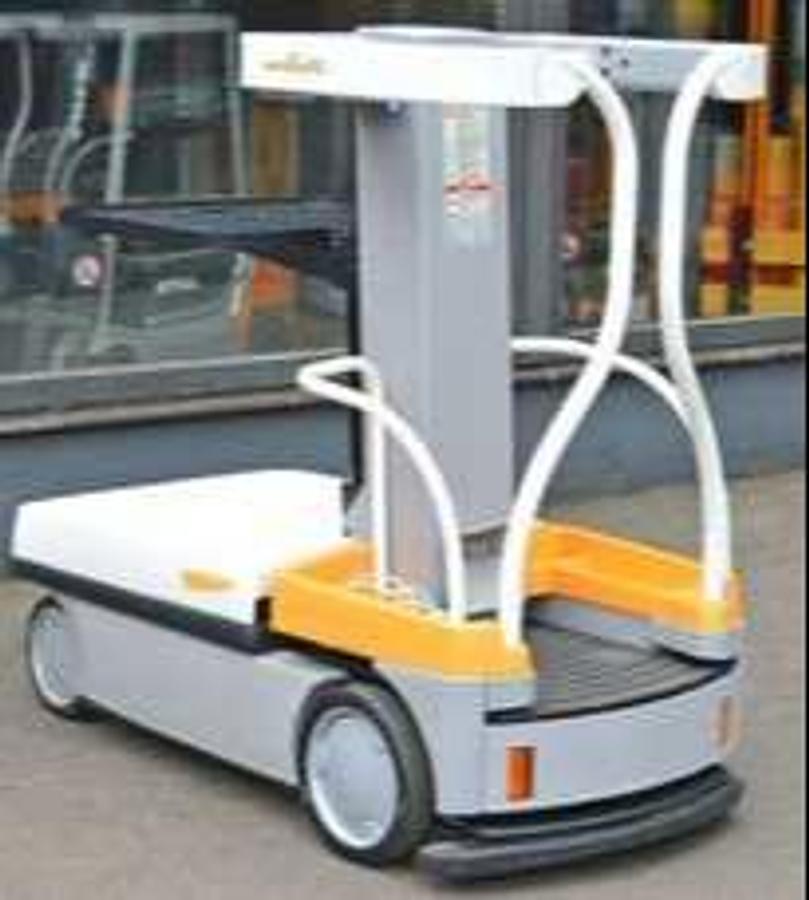 Rear‑angle view of a 2010 Crown WAV50‑118 work assist vehicle highlighting compact chassis, operator enclosure, and electric indoor design