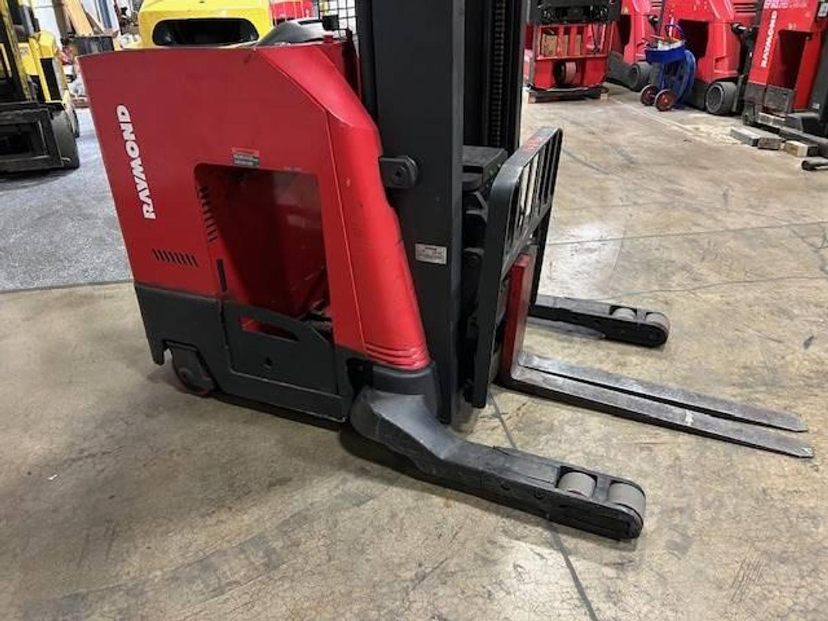 view of battery compartment, chassis,mast, carriage and straddle legs