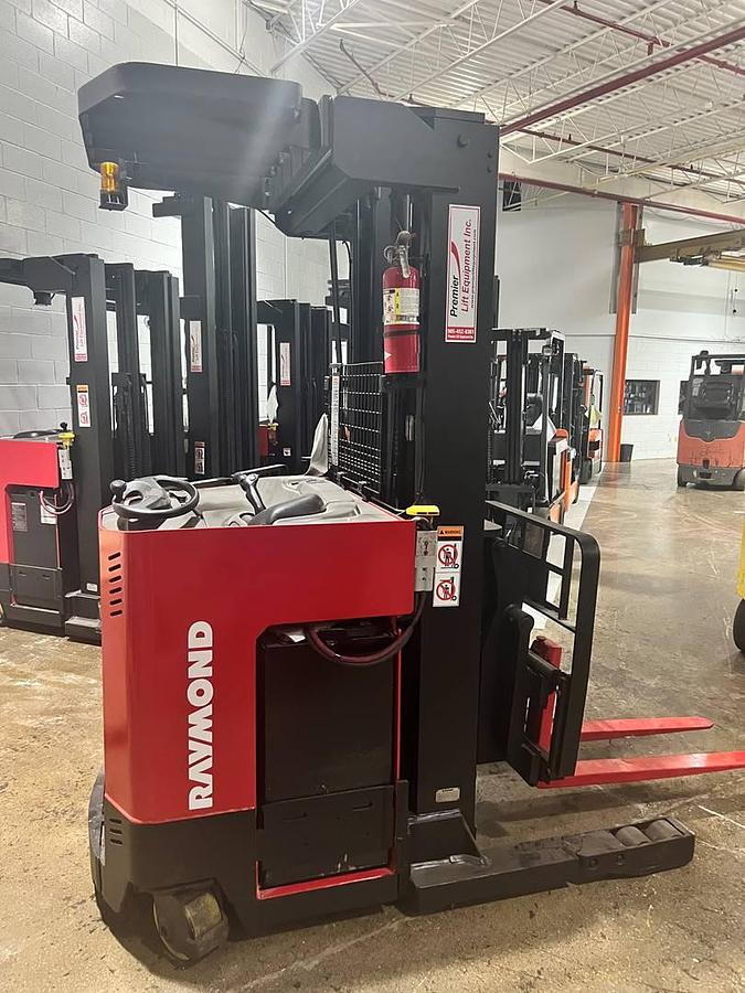 Side view of CSA-certified Raymond EASIDR30TT electric deep reach truck with pantograph arm – staged in Brampton ON