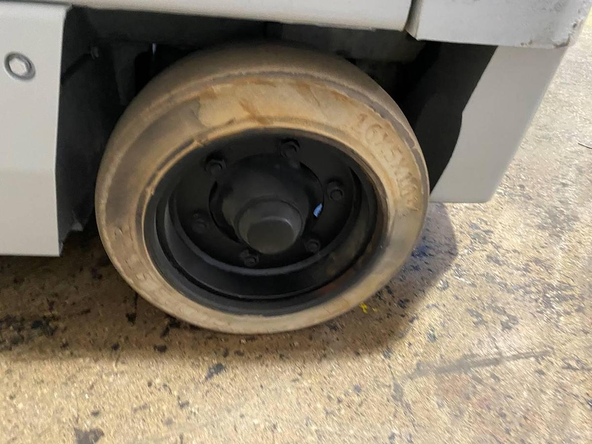 Left cushion steer tire showing wheel hub and CSA spec