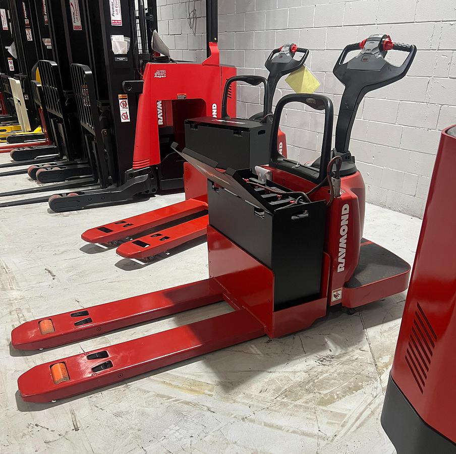 Budget Raymond 8400 walkie pallet jack, older non‑CSA unit, 6,000 lb capacity with 27×48 forks and 24V electric system.