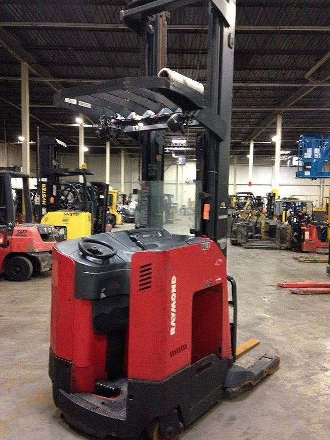Rear side view of refurbished 2007 Raymond 740-R35TT electric reach truck showing counterweight, rear panel, and chassis weldments during Toronto deployment