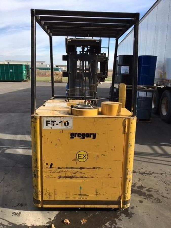 Rear view of refurbished 2008 Gregory RC4EX EX rated explosion‑proof dockstocker showing rear chassis, counterweight, battery compartment, solid drive tires, and CSA/MOL certification decal during Brampton deployment.