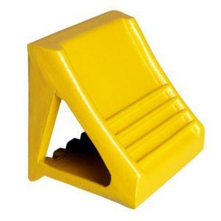 Front view of refurbished CBI‑087 cast ductile iron wheel chock showing 8‑1/4" width, snug tire contour fit, painted yellow finish, and CSA certification decal during Brampton deployment.