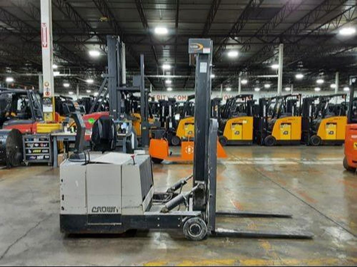 Side view of refurbished 2015 Crown 30WBTF electric walkie counterbalanced stacker showing 2‑stage mast, 3,000 lb capacity, and CSA certification decal during Ontario deployment.