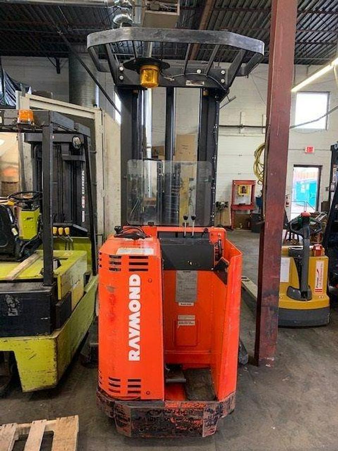 Back view of vintage 1992 Raymond 20IR40TT electric order picker showing rear chassis, battery door, and CSA inspection decal during Concord deployment