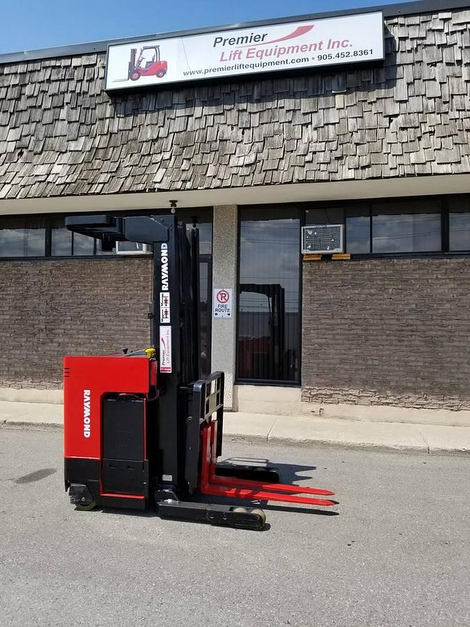 Refurbished 2013 Raymond EZ R30TT electric reach truck with CSA certification and new paint deployed in Mississauga for narrow aisle warehouse operations
