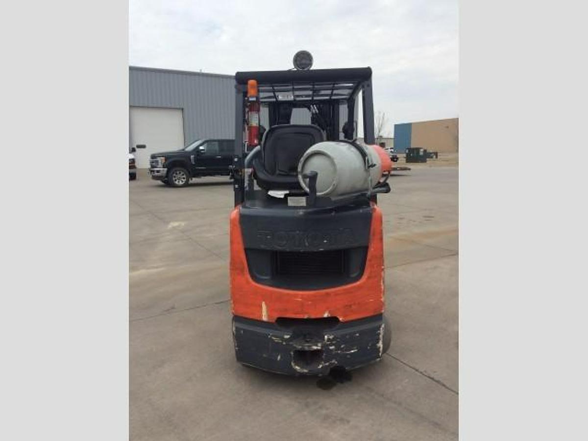 Rear view of refurbished 2014 Toyota 8FGCU30 LP gas forklift showing counterweight, propane tank mount, and CSA inspection tag during Brampton deployment