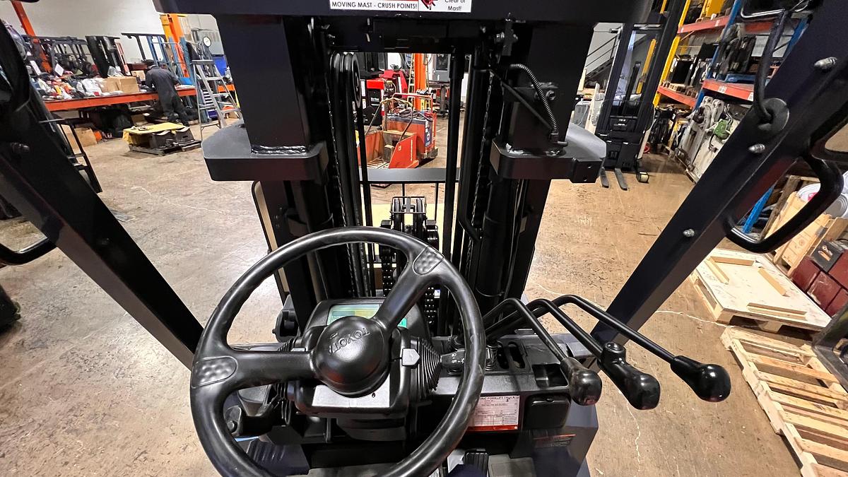 Operator seat view showing dashboard, controls, and CSA labeling