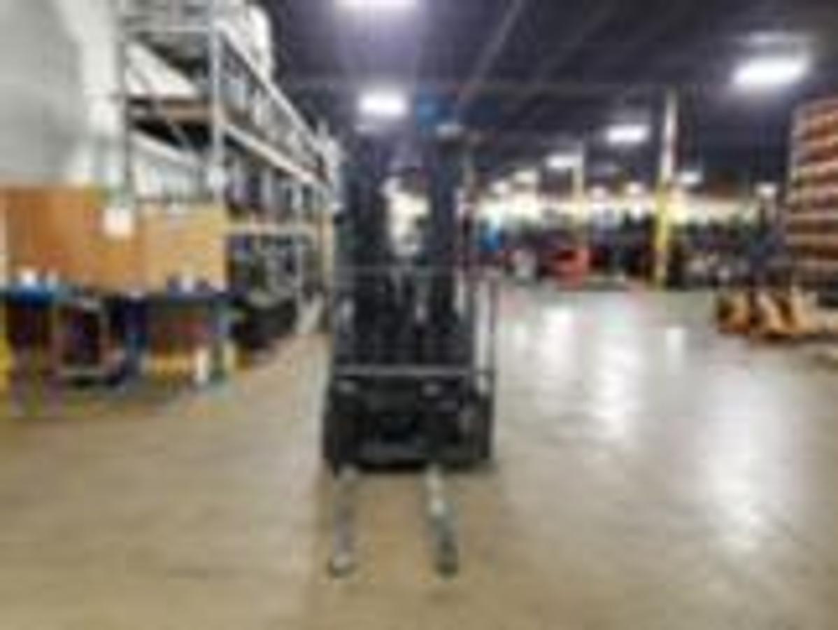 Front angled view showing mast rails and 42” fork tips