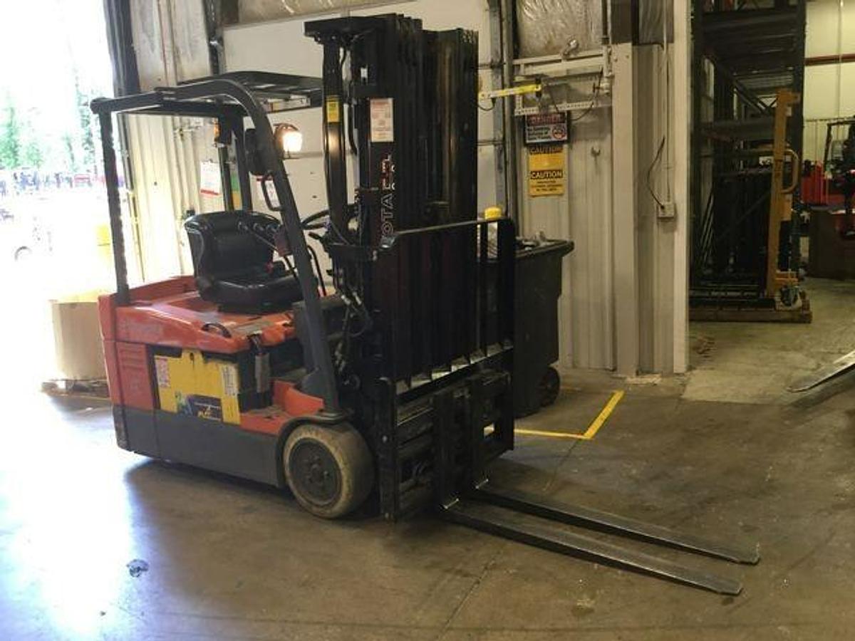 Used 2015 Toyota 7FBEU20 electric forklift with 240" quad mast and CSA decals shown at front side angle during Brampton deployment