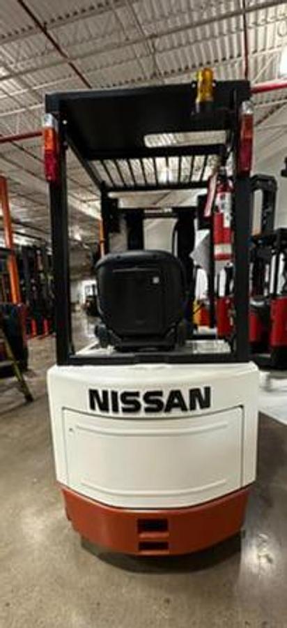 Rear view of Budget Nissan CWP02L25S older electric forklift, non‑CSA.